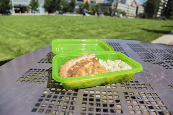a lunch in a green plastic tuppy