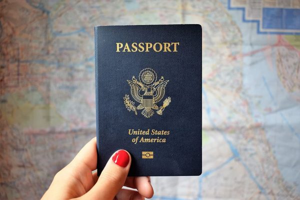 hand holding up a passport