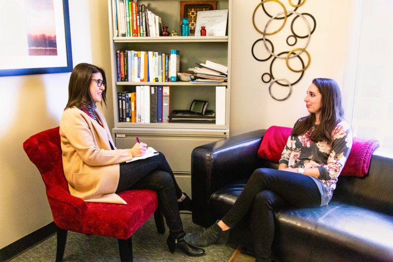 two women seated during a counselling session