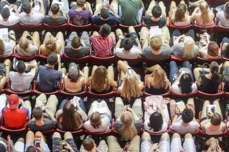 Aerial photo of students sitting in auditorium seats