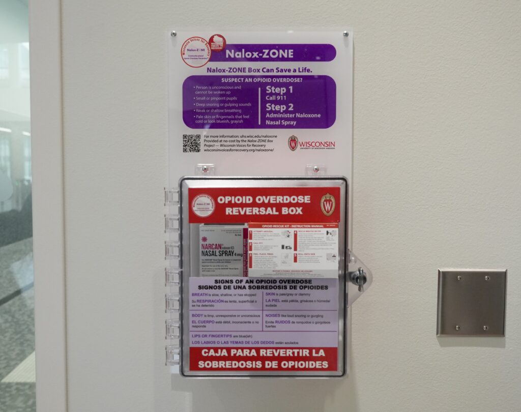 A wall-mounted box containing Narcan