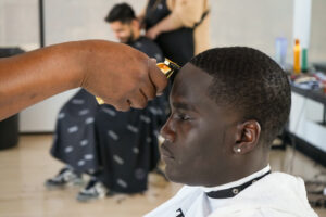 Male getting hair cut