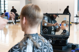 Back of male's head getting a haircut