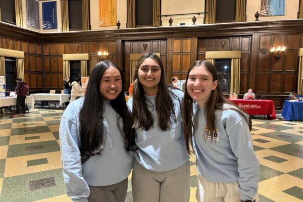 Three members of the mental health student advisory board at the mental health resource fair in 2025.