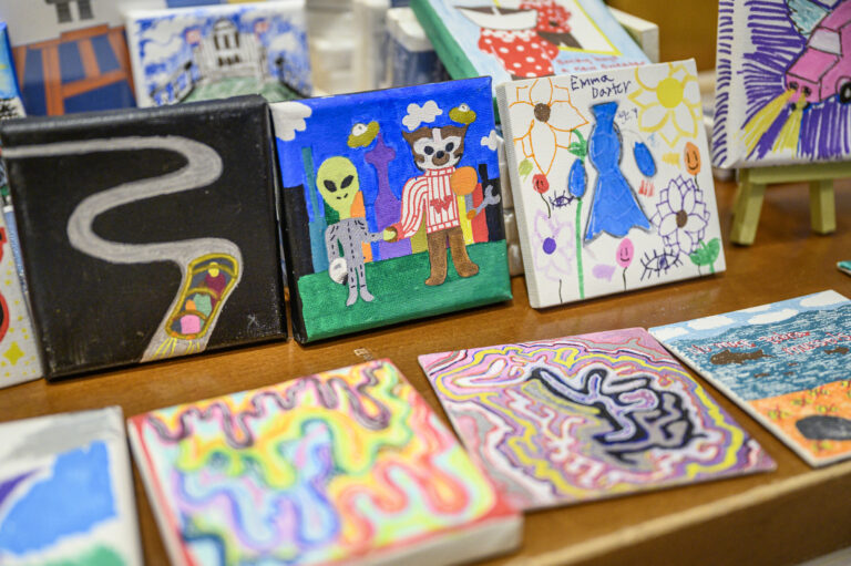 mini art and doodle prints displayed on a table