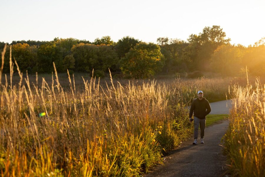 Person walking on a trail at the UW Arboretum