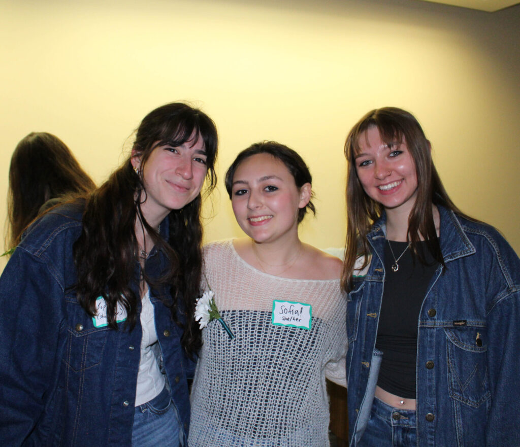 Students smiling together at the Reflect Closing Ceremony