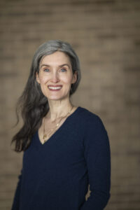 Colleen Conroy, assistant professor in theater and drama in the School of Education is pictured outside Vilas Hall, home of University Theater, at the University of Wisconsin–Madison on Feb. 10, 2026. Conroy is one of thirteen recipients of a 2026 Distinguished Teaching Award (DTA). (Photo by Taylor Wolfram / UW–Madison)