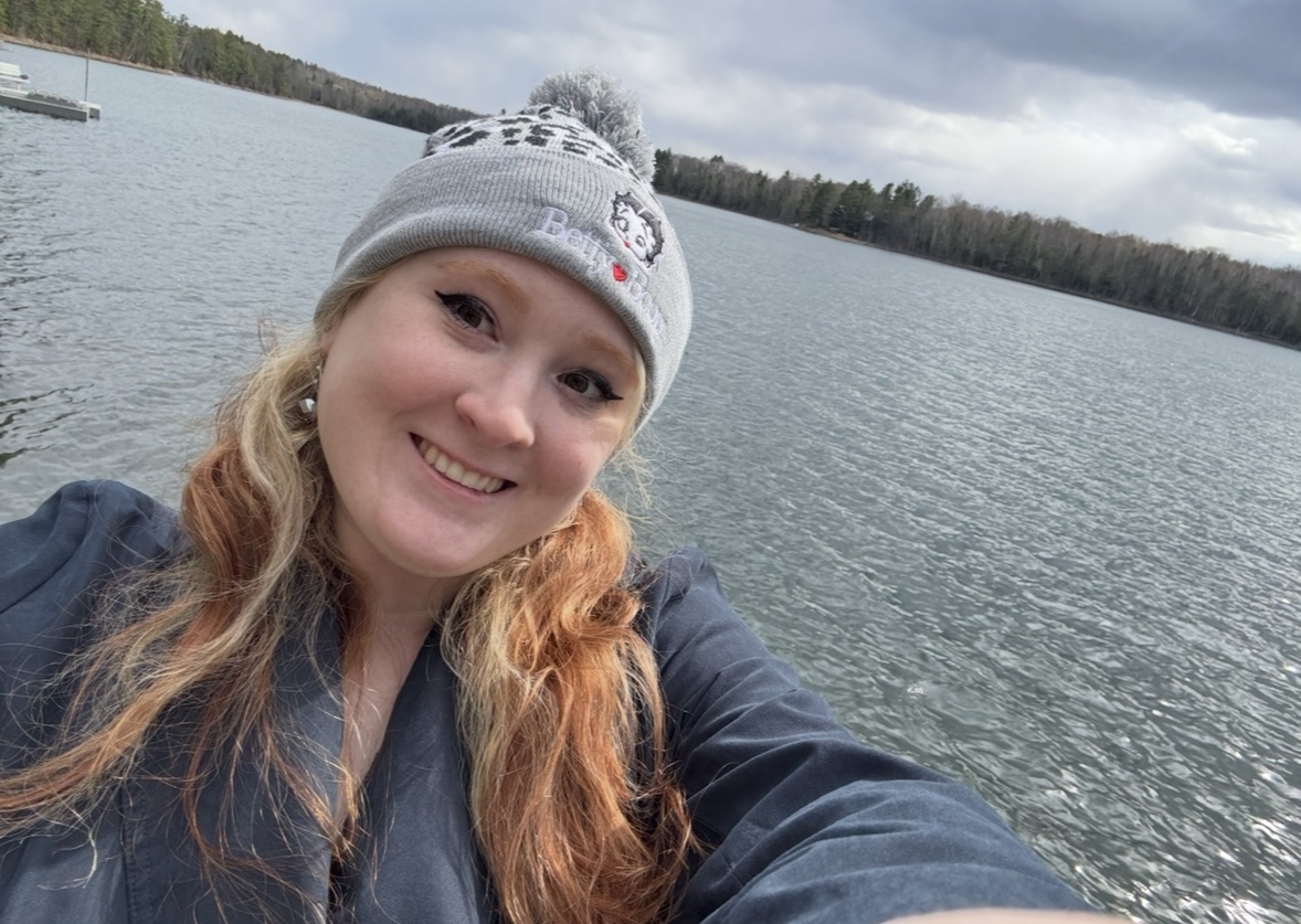 Kari True smiling with lake in background