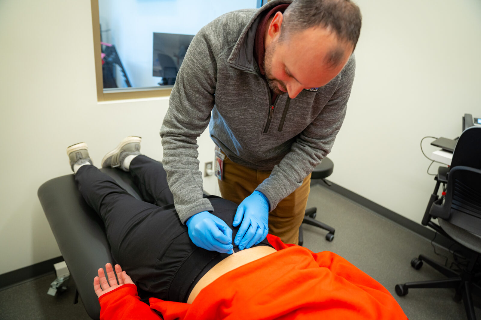 Kyle Gibson treats a patient