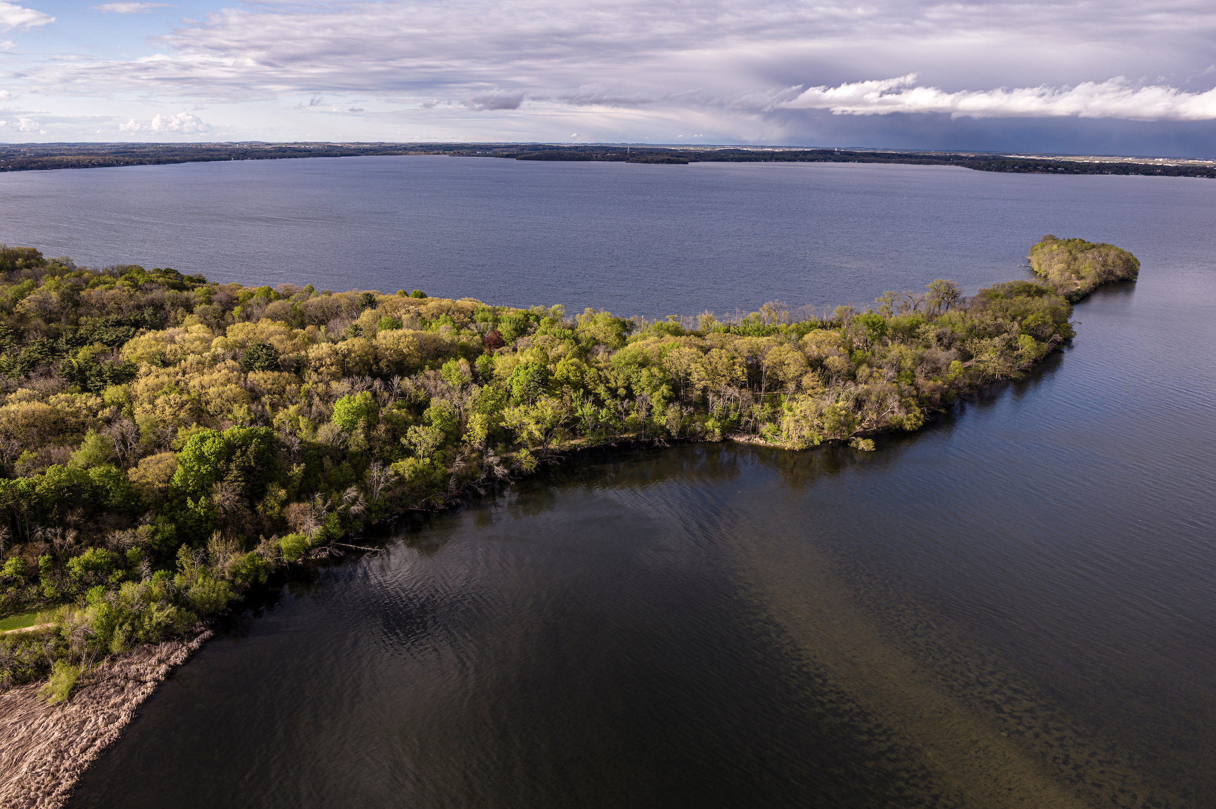 Picnic Point, part of the Lakeshore Nature Preserve, stretches into Lake Mendota as seen by a drone.